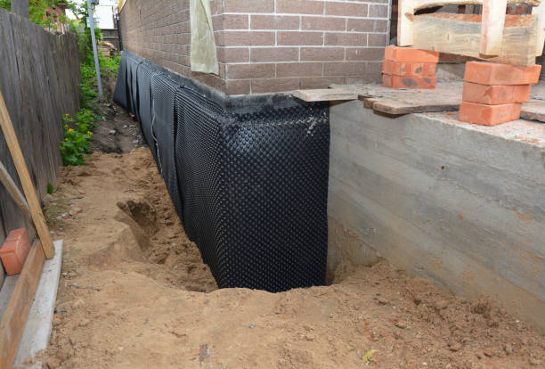 Happy homeowners after waterproofing job in Millville